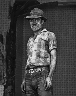 Hulme: Workman covered in dirt, Hulme, Manchester