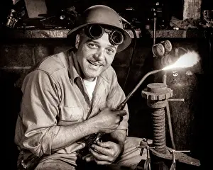 Acetylene: Workman Looking at Camera wearing Hard Hat and Safety