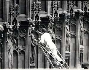 Colonnades: Workman preventing pigeons from perching, Westminster