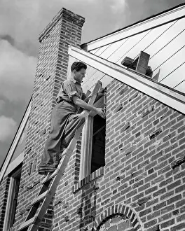 Stepladder: Workman on Stepladder Fitting a New Window on