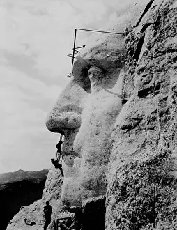 Midwest: Workmen on face of George Washington at Mount