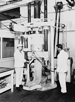 Bsloc1608: Workmen operating a spaghetti press at the H.J