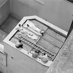 Laziness: Workmen taking a break
