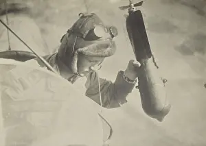 Fedele: World War 1 flyer holding a bomb in his hand, waiting