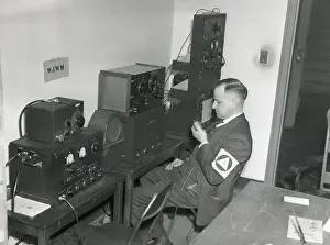 Civil Defense: World War 2 civil defense worker monitors three