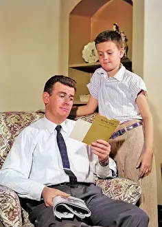 Grades: Worried Boy Standing Looking Down at Skeptical