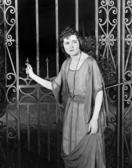 Timid: Worried woman at gate