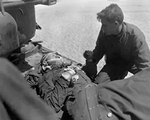 Litters: Wounded, but alert, U.S. soldier in an outboard