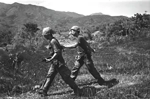 Stocktrek Images: A wounded soldier is led to a medevac helicopter
