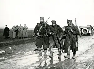 Pals: Wounded soldier on muddy road, Macedonian Front, WW1