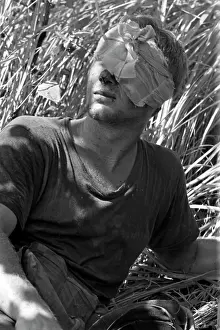 Stocktrek Images: A wounded soldier waits for a medevac helicopter