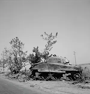 Battletank: Wreckage of a General Sherman tank and a German