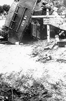 Flght: A wrecked armoured car marked as a war grave