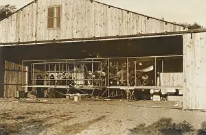 Lcgr1802: Wright Brothers airplane in its hanger on