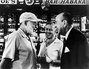 Sloppy: Writer ERNEST HEMINGWAY chats with actors ?