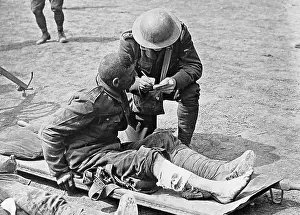 Tommies: WW1 Chaplain with wounded soldier 1914 - 1918