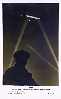 Nightime: WW1 - Zeppelin over the UK illuminated by searchlights