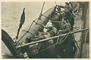 Outboard: WW2 Minesweeper Crew Hoisting A Float