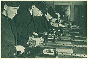 Armourers: WW2 - R.A.F. Armourers Assembling Guns