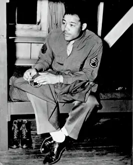 Champ: WWII, Joe Louis Sews On Sergeant Stripes, 1945