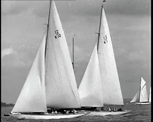 Yachts: Two Yachts Single-Masted Viewed Side On With