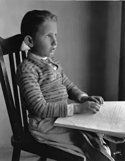 Braille: Six year old 1st Grade blind boy studying lesson in braille
