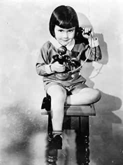 Telephoning: A four year old girl telphoning
