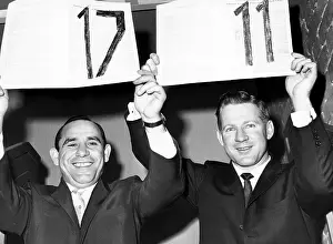 Whitey: Yogi Berra and Whitey Ford hold up their ?