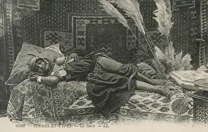 Siesta: Young Algerian lady on a divan