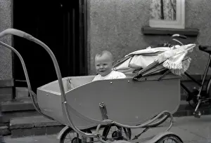 Perambulator: A young baby in a fine perambulator
