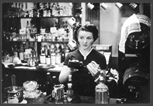 Barmaids: Young barmaid at work in a Soho pub, London