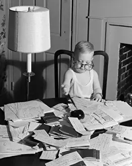 Receipts: Young Boy At Desk Wearing Glasses