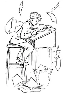 Homework: A young boy doing his homework at a desk
