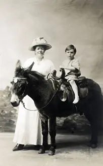 Dec19: Young Boy and his Mother - Studio photo on a donkey