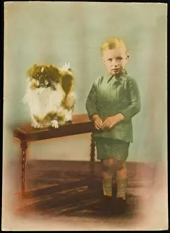 Tabletop: YOUNG BOY AND PEKINGESE