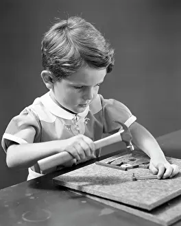 Dexterity: Young Boy Playing with Construction Learning Board Game