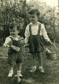 Dungarees: Two young boys on an Easter egg hunt
