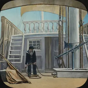 Coils: Young cabin boy sailor sorting out ropes