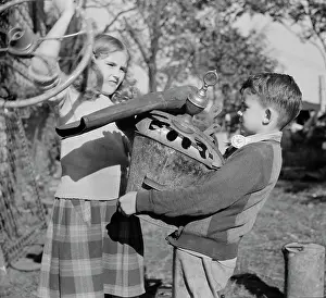 Recycling: Young children collecting scrap for donation