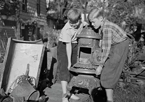Recycling: Young children collecting scrap for donation