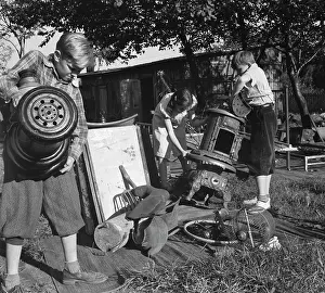 Backyard: Young children collecting scrap for donation