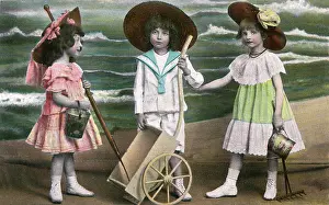 Wide Brimmed: Three young children at the seaside - kitsch postcard