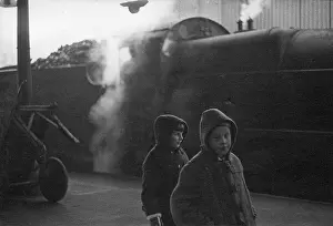 Mogul: Two young children in front of steam engine
