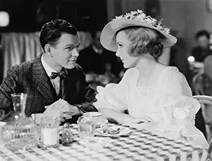 Desirable: Young couple dining in restaurant