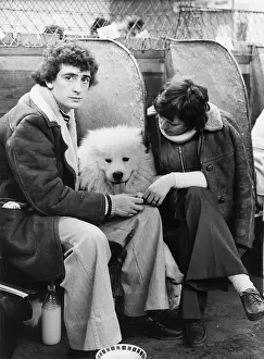 Compartments: Young couple and dog at a dog show