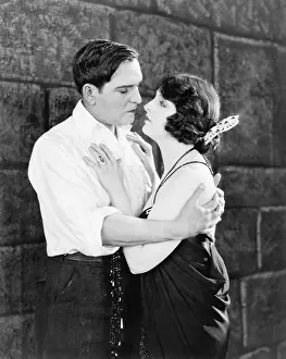Coquettish: Young couple embracing each other