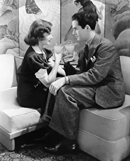 Intensity: Young couple having a drink