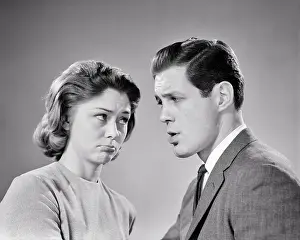 Squabble: Young Couple Looking at one Another with Angry