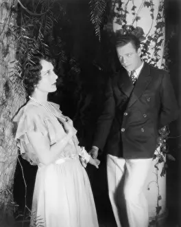 Affections: Young couple standing together and holding hands