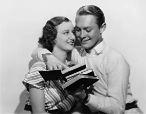 Classmates: Young couple study books together